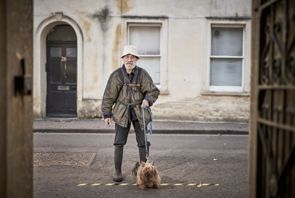 Social Distance (Frank exercising one of his many dogs), 2020 © George Brooks